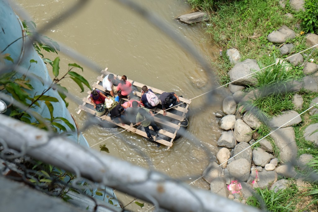 Family crosses the Suchiate River at Talisman, Chiapas, Mexico, where the Guatemalan-Mexican border divides the town. Photo by Charlie Thompson, 2015.